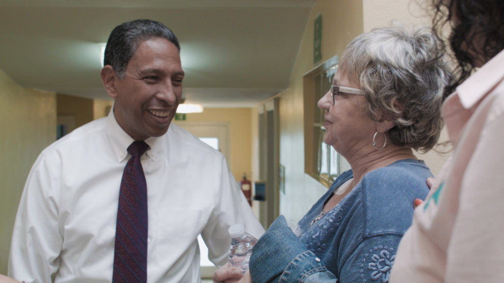 Dr Tony Talks with Female Patient in Tijuana Center