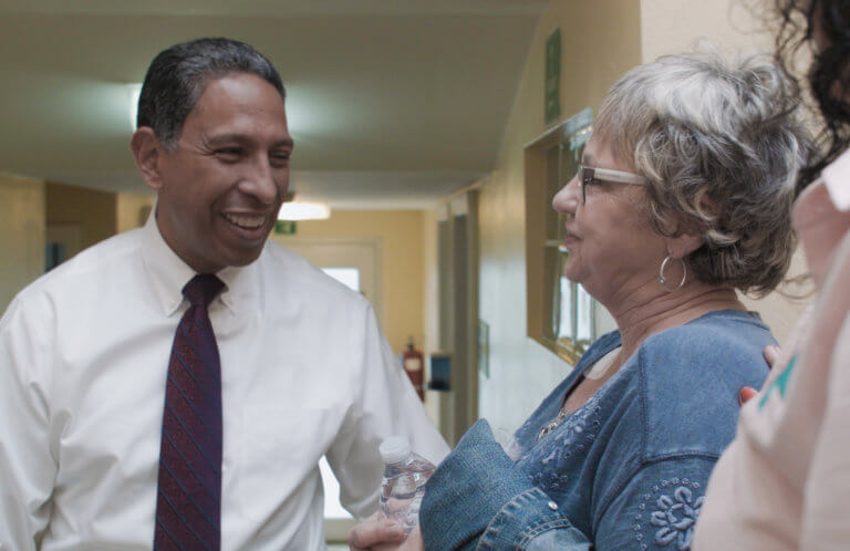 Dr Tony Talks with Female Patient in Tijuana Center