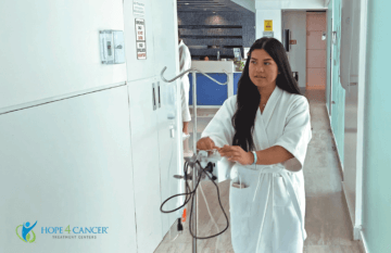 Patient walking with IV in Cancun center