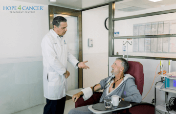 Doctor speaking with patient during treatment