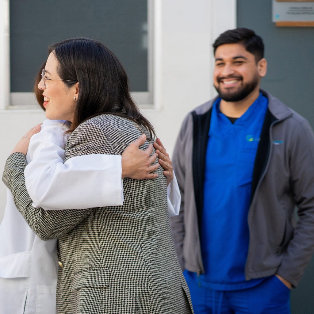 A patient and doctor embracing