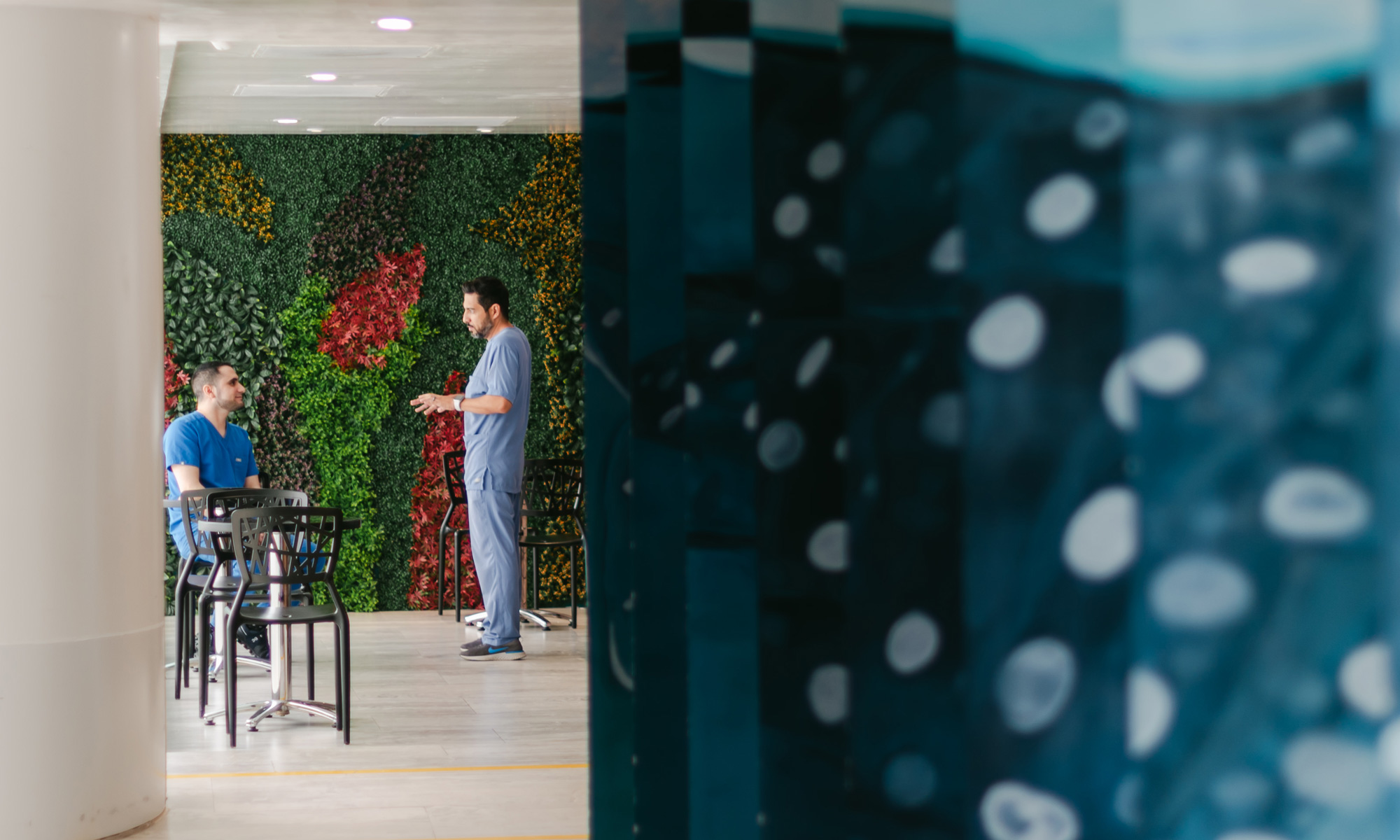 a photo of doctors talking at Hope4Cancer