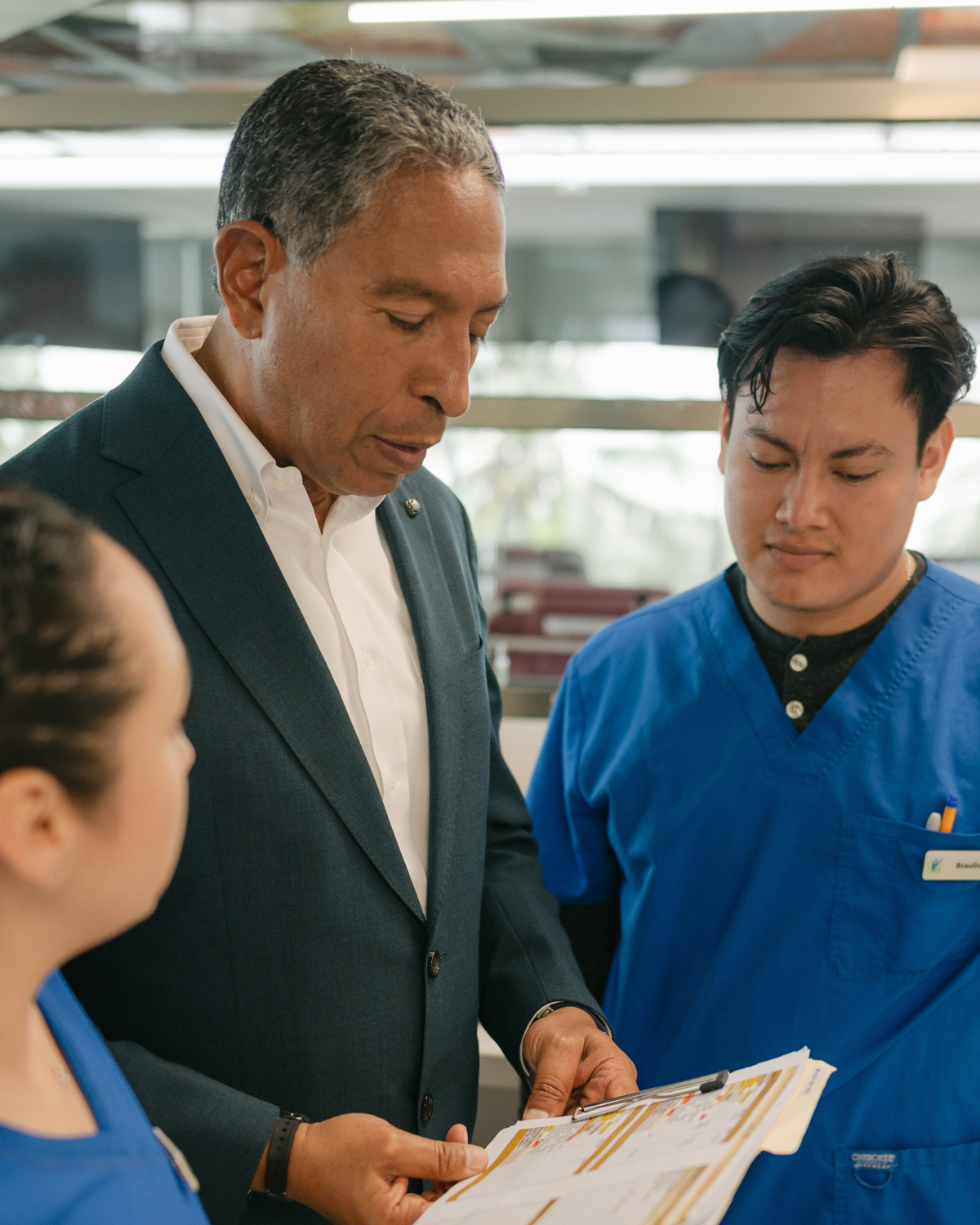 Dr. Tony Jimenez speaking with a patient at Hope4Cancer