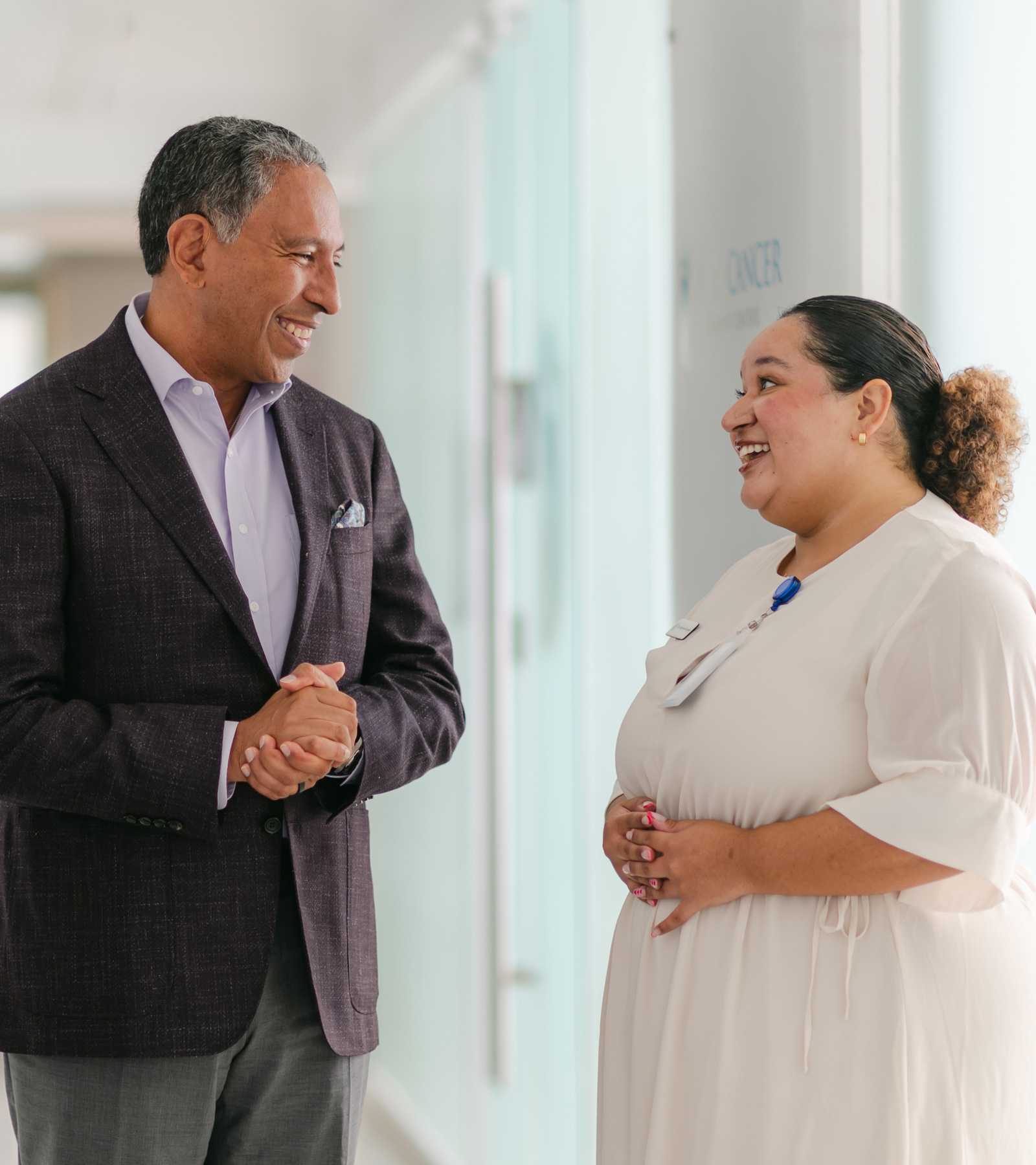 Dr. Tony Jimenez speaking with a patient at Hope4Cancer