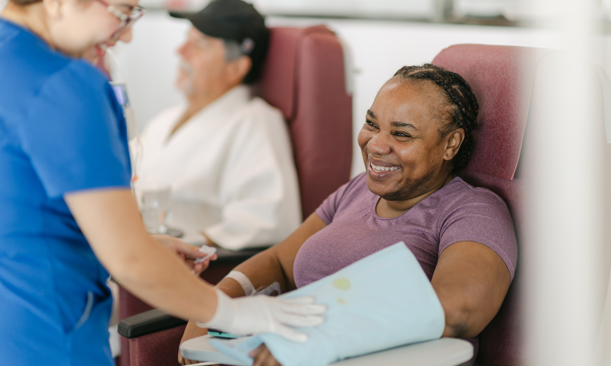 A nurse caring for a patient at Hope4Cancer