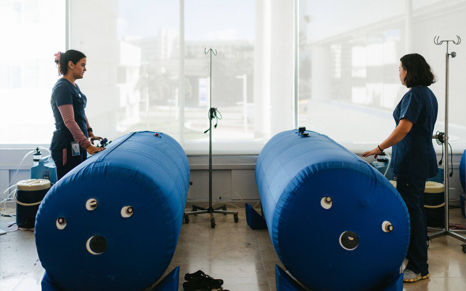 a photo of two nurses and medical equipment