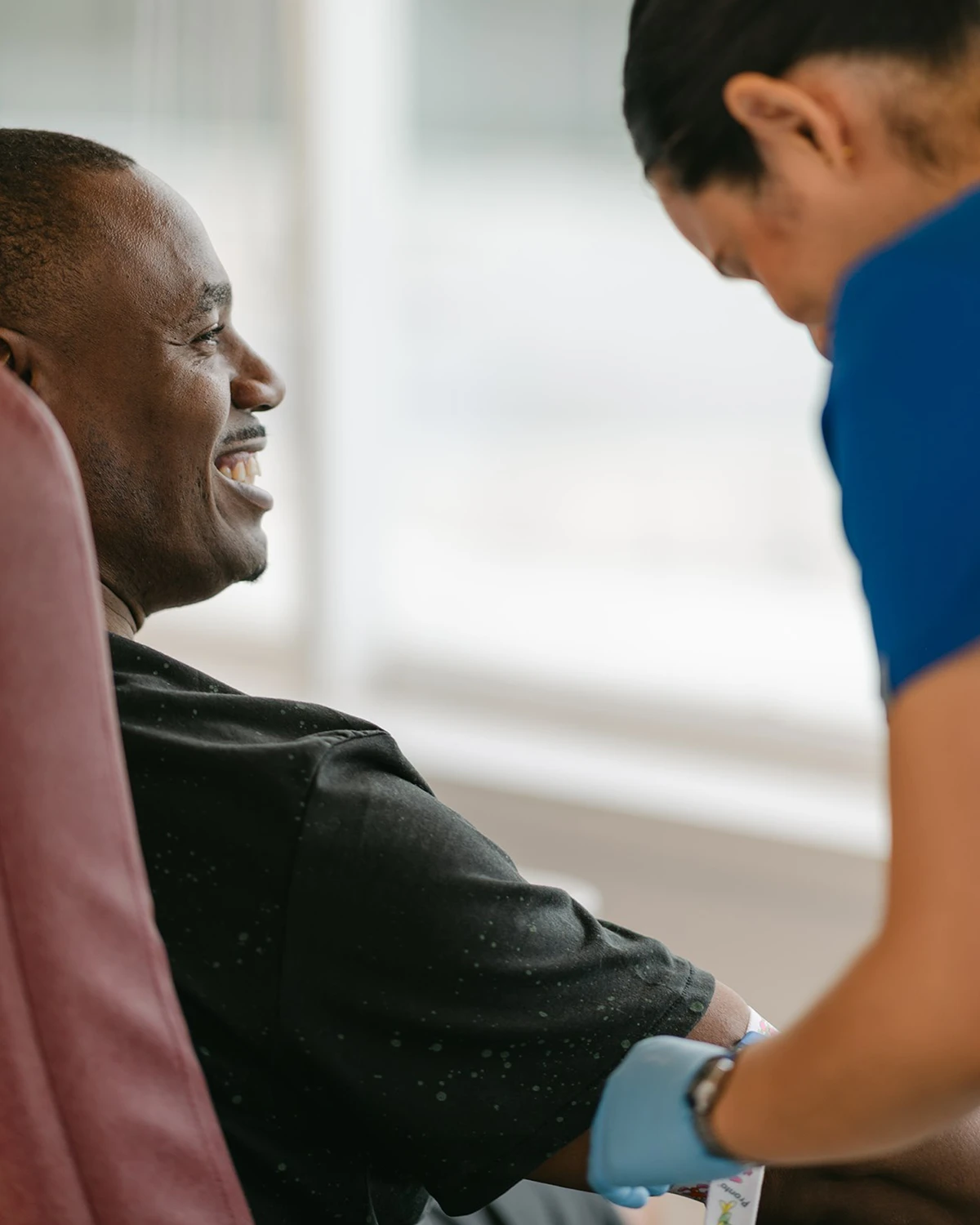 A nurse administering medicine to a patient
