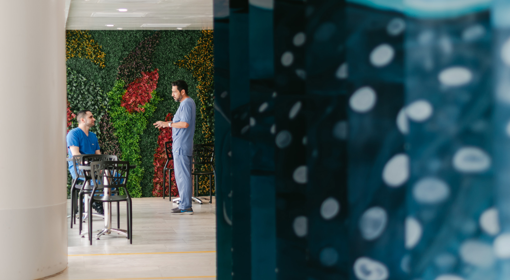 a photo of doctors talking at Hope4Cancer