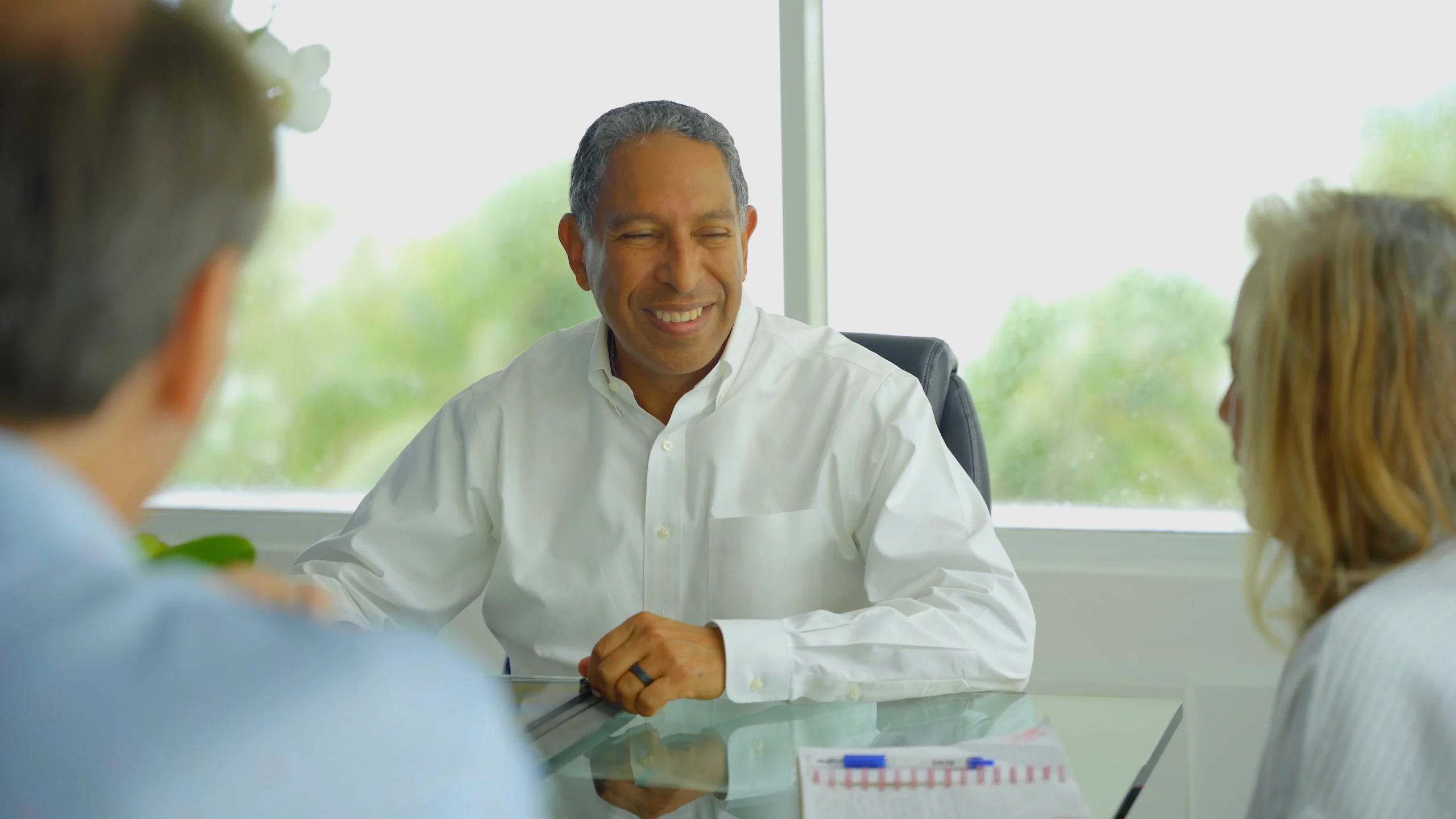 Dr. Tony Jimenez speaking with patients